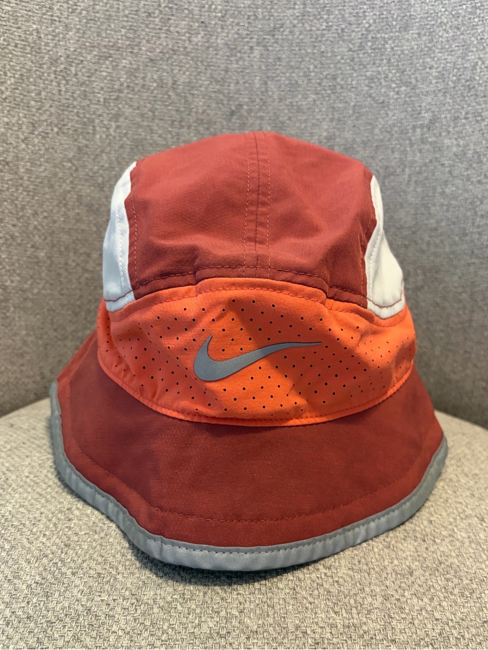 NIKE- size M/L Dri-FIT Perforated Running Bucket Hat. Magic ember/orange/grey